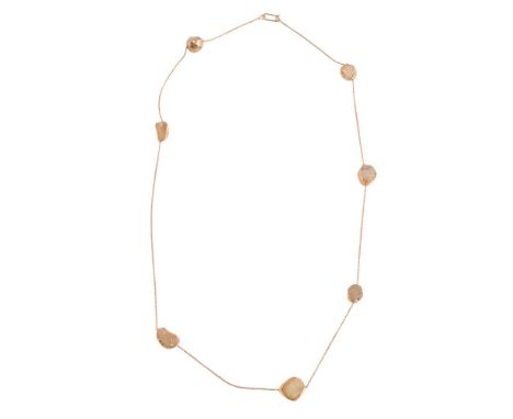 A GOLD COLOURED AND TUMBLED QUARTZ NECKLACEThe tumbled quartz in collet settings, with belcher link chain connectors, with ho