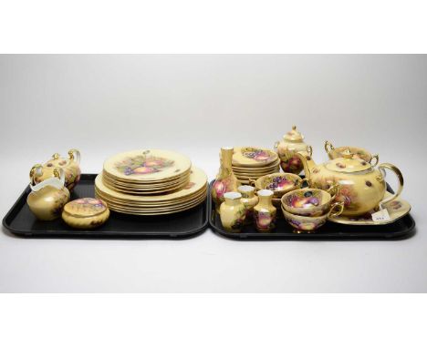 An Aynsley ‘Orchard Gold’ pattern tea and dinner service, including: six place settings, tea pot, cream, sucrier, pin dish wi