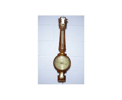 A Victorian walnut wheel barometer, 98cms high.