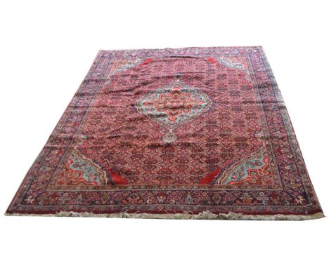 Bidjar carpet, the central medallion surrounded by repeated floral design, 350 x 226cms.