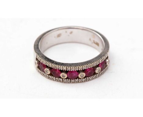 A ruby and diamond ring, the five rubies surrounded by diamonds, in 18ct white gold mount, ring size N, 6.7g gross. 