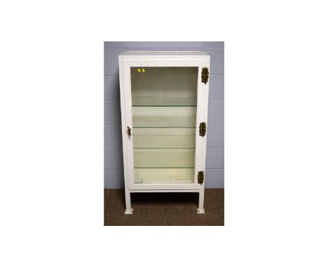 A vintage white-painted metal surgical instrument display cabinet, on square section supports, 66 x 38 x 133cms high.