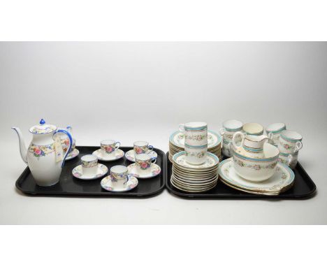 An Aynsley floral decorated coffee service, with rose and colourful flower head decoration, blue borders, comprising coffee p