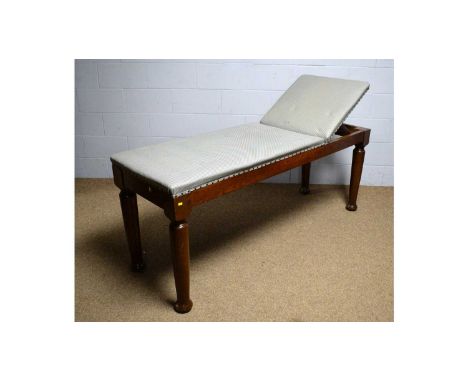 A vintage oak examination couch, the upholstered top with rachet adjusted back support, 183 x 62 x 77cms high.
