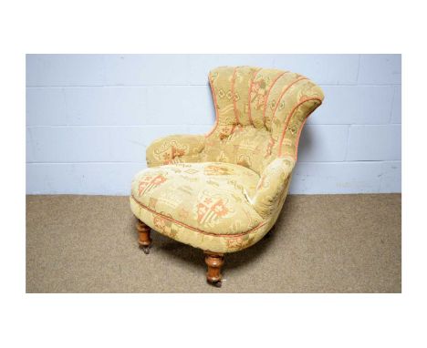 A Victorian-style tub chair, with shaped back, outsplayed arms and bowfront seat in a textured gold upholstery with heraldic 