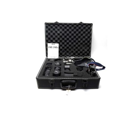 A collection of cameras, lenses and camera accessories, including: Nikon F65 camera, with instruction manual; Canon EOS 300; 