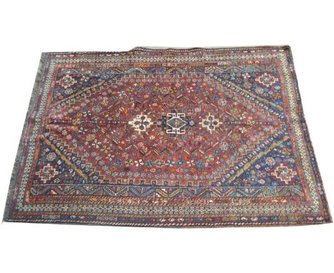 A Qashqai carpet, the small medallions surrounded by flower-head design, 247 x 173cms.