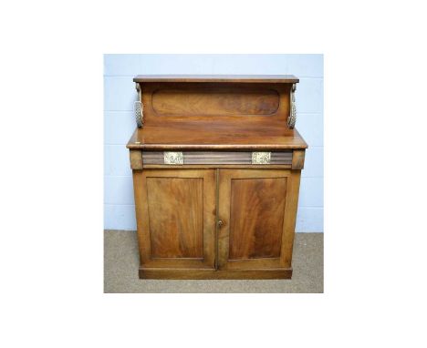 A Regency-style mahogany chiffonier, with shelved superstructure on ivory painted scroll supports, the lower section with flu