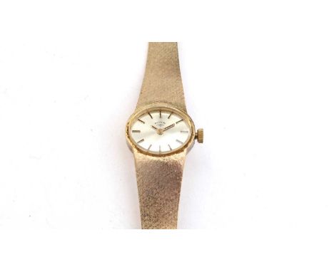 A 9ct yellow gold cocktail watch by Rotary, with baton dial, manual wind movement, and mesh strap, 27.9g gross. 