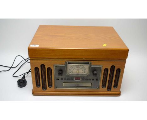 A Crosley Model 1189986 record player, with turntable, CD player and radio function, with instruction manual.