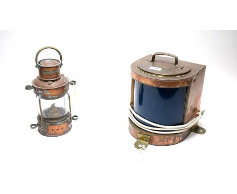 A copper and brass ship's lamp, with inset bowed blue glass panel, later wired for electricity, 27cms high; together with a m