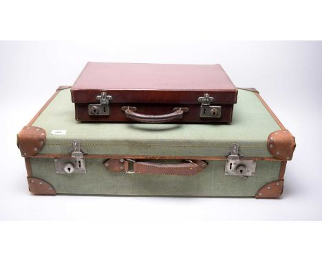 A vintage brown leather bound green canvas suitcase; together with a smaller vintage suitcase. (2)