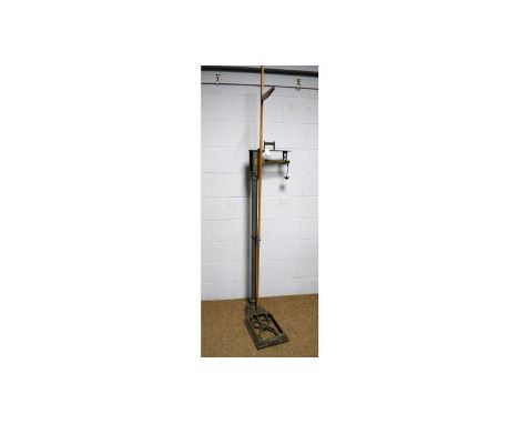 Vintage cast iron weighing scales by W &amp; T Avery, Birmingham, up to 24 stones, with attached wooden height measure, 218cm