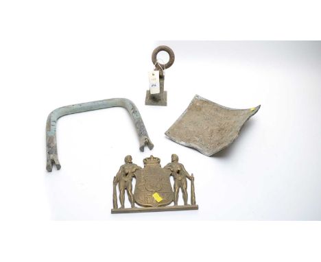 A Continental brass wall plaque, formed as a shield-shaped crest flanked by Roman figures; together with other metal wares in