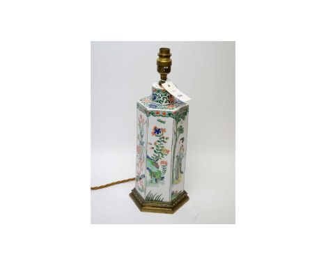 A Chinese hexagonal ceramic table lamp, decorated with figures and flowering foliage, with gilt metal light fitting and base,