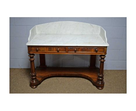 A Victorian mahogany marble top washstand, the three-quarter gallery marble top above two short drawers, on turned and fluted