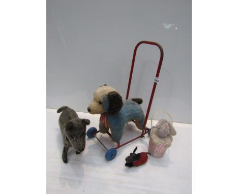 A selection of stuffed vintage animals including Schuco wind-up dog, Chad Valley push-a-long dog etc 