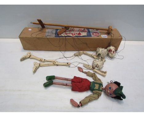 A boxed Pelham Puppet skeleton and unboxed Hansel Pelham 