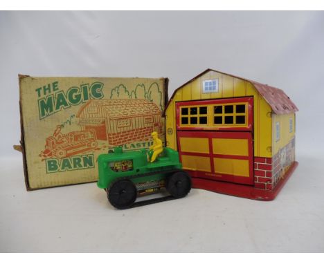 A 1960s American plastic barn and tractor, boxed.