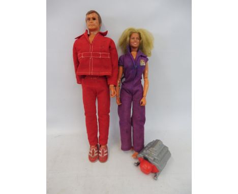 Two Six Million Dollar Man dolls including The Bionic Woman complete with the engine block. 