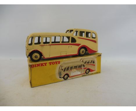 An early Dinky Observation Coach, box in average but crushed condition, model has paint chips. 