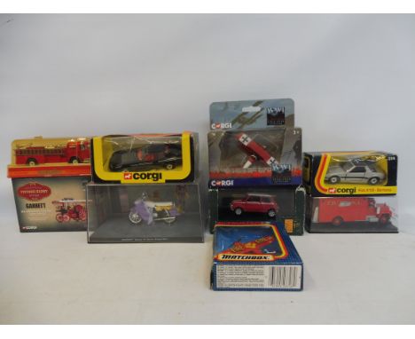 A selection of boxed Corgi die-cast vehicles including a Jaguar XJS, a Showman's Tractor Lord George, a Mini Cooper etc. 