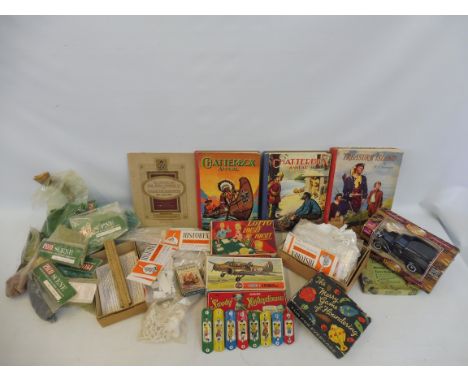 A tray of railway accessories, bags of plastic model figures, books etc.
