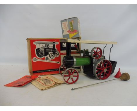 A boxed Mamod traction engine and a boxed Mamod power press.