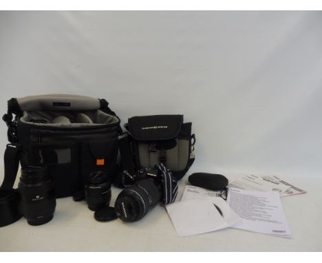 An Olympus E-400 digital camera with lenses.