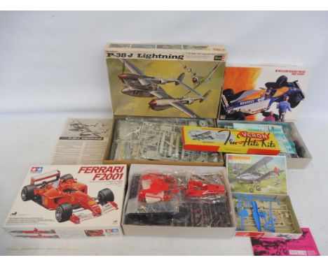 A collection of unmade kits - Revel, Tamiya etc. The P38 Lightning 1/32 scale, all unchecked.