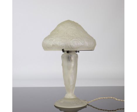 Pressed glass lamp ca 1930, Foot decorated with a young naked womanPeriod: XXth - 20th centurySizes: Dia: 230 mm H: 390 mmWei