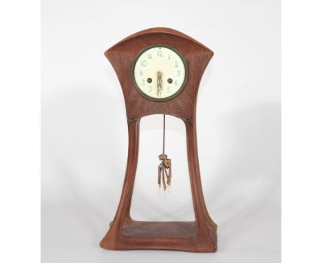 LOUIS MAJORELLE (1859-1926) Rare table clock with curved body in mahoganyPeriod: XXth - 20th centurySizes: H=410mm L=220mmWei