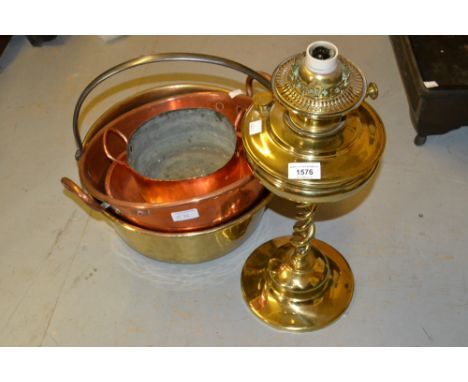 Brass open spiral twist oil lamp, brass preserve pan, copper preserve pan and two other copper pans 