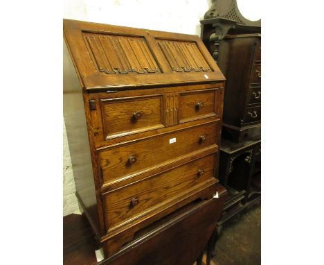 Ercol dark ash bureau with carved linen fold fall front 