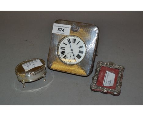 Nickel plate Goliath pocket watch in a silver mounted travel case, a miniature silver photograph frame and a small silver tri