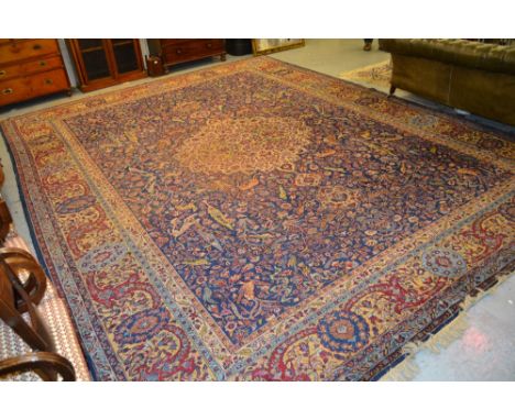 Sparta carpet with a medallion and all-over animal, bird and floral design on a blue ground with borders, 16ft x 12ft 5ins ap