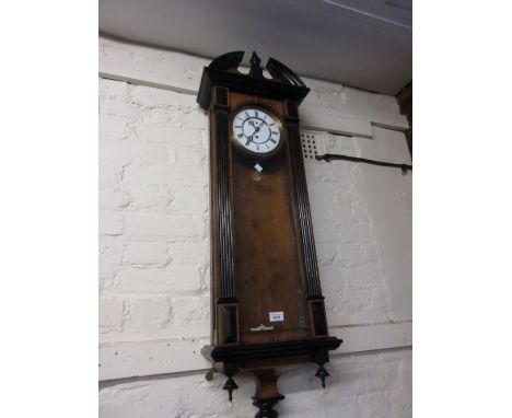 19th Century Vienna type walnut and ebonised wall clock, the circular enamel dial with Roman numerals and subsidiary seconds 