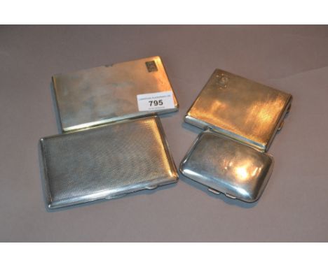 Three various silver engine turned cigarette cases and a small plain silver cigarette case 