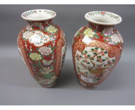 Pair of Japanese bird and floral enamel decorated vases (one at fault), 10ins high 