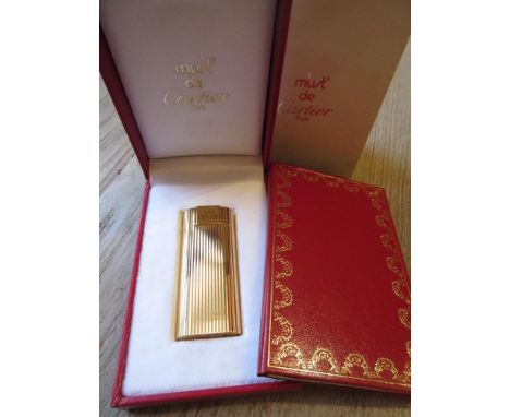 Must de Cartier gold plated cigarette lighter with original box and paperwork 