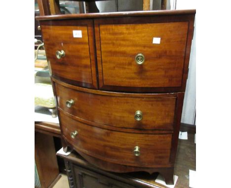 George III mahogany and black line inlaid bow front commode with two doors above two drawers, raised on low splay feet 