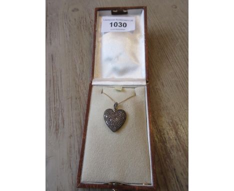 Diamond set heart shaped pendant on chain 