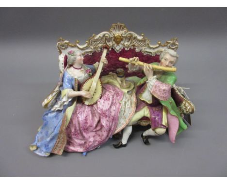 19th Century Continental Meissen style group of lady and gentleman musicians on a sofa (restored) 