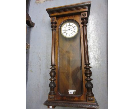 19th Century walnut Vienna wall clock, the circular enamel dial with Roman numerals and subsidiary seconds dial with a two tr