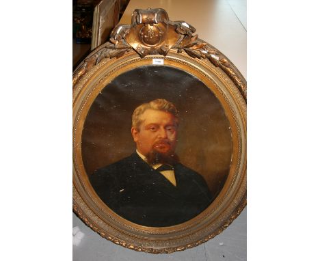 19th Century oil on canvas, head and shoulder portrait of a gentleman in an oval gilded composition frame with scroll mount, 