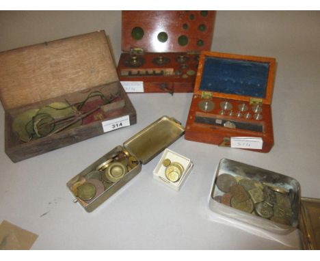 Oak cased set of balance scales, two cased sets of weights and a quantity of loose weights 