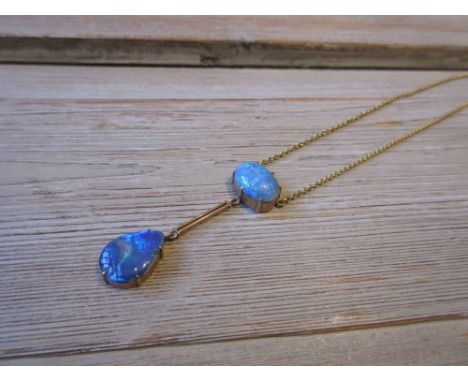 Early 20th Century pendant set two opals on an unmarked chain 