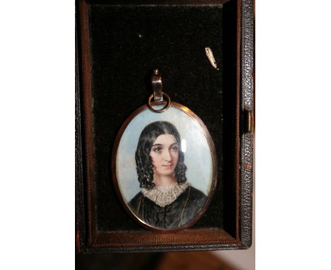 Mid 19th Century miniature oval portrait of a young lady with lace collar, inscribed verso ' W. Tiffin, London 1854 ', bearin