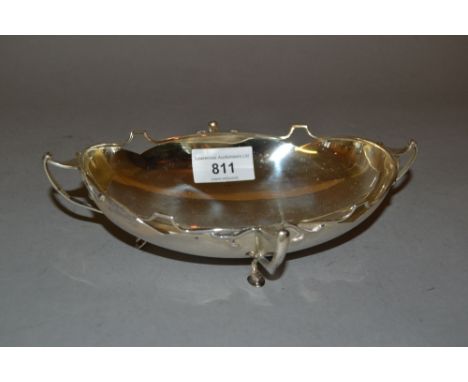 Oval Birmingham silver trinket dish of Art Nouveau design with shaped and pierced rim on four shaped supportsFeet are bent ou