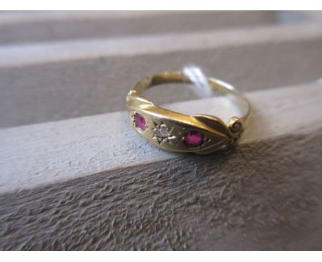 18ct Gold three stone diamond and ruby ring 